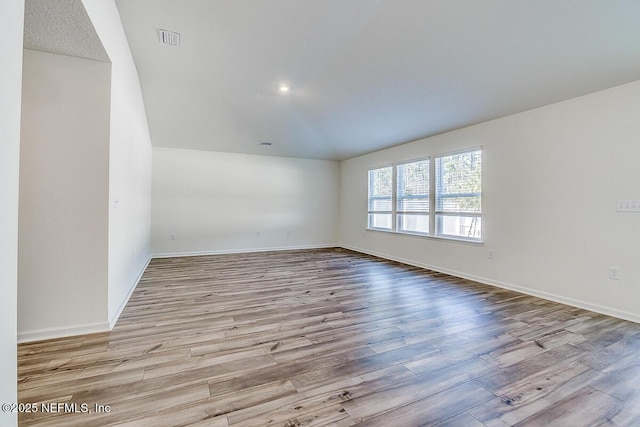 unfurnished room featuring light hardwood / wood-style floors