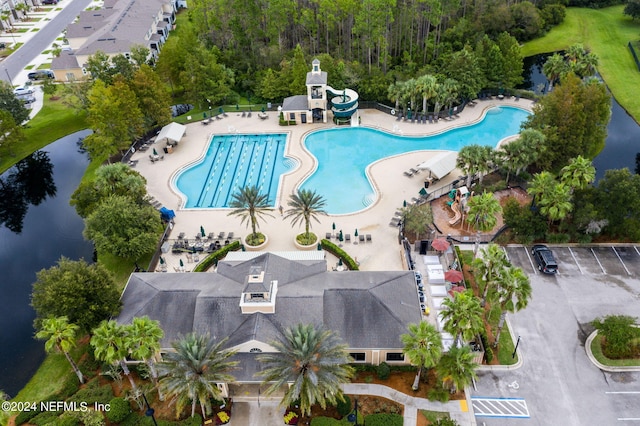 birds eye view of property with a water view