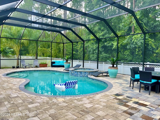 view of pool with a patio, an outdoor living space, a lanai, and a pool with connected hot tub