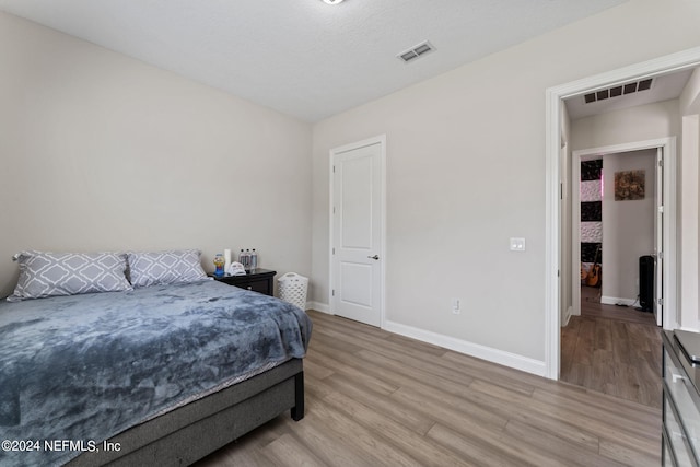 bedroom featuring light hardwood / wood-style flooring