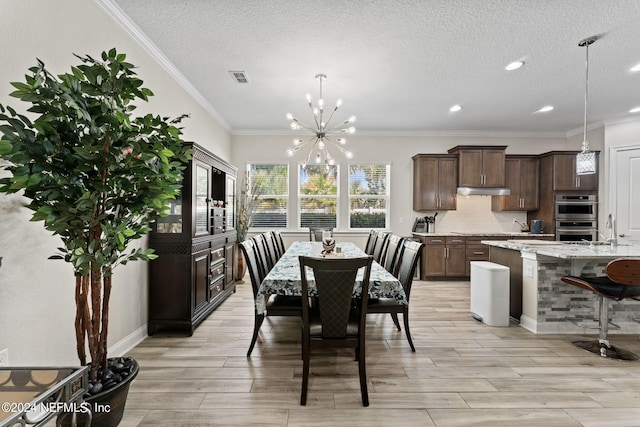 dining area with wood tiled floor, visible vents, a notable chandelier, and a textured ceiling