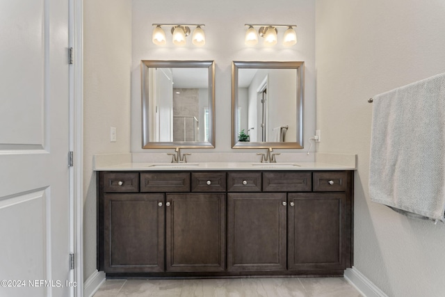 bathroom featuring vanity and tile patterned flooring