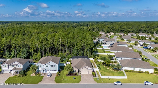 aerial view with a forest view and a residential view