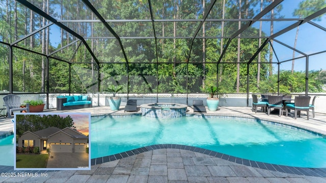 view of swimming pool featuring a pool with connected hot tub, a patio area, a lanai, and an outdoor hangout area