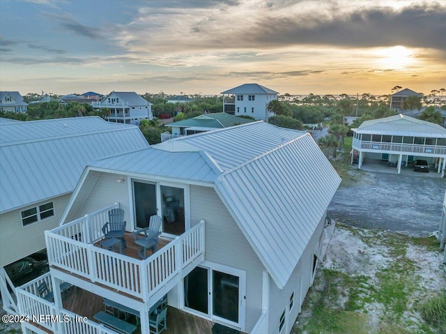 view of back house at dusk