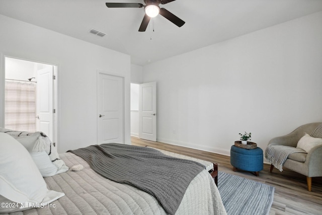 bedroom with ceiling fan and light hardwood / wood-style floors