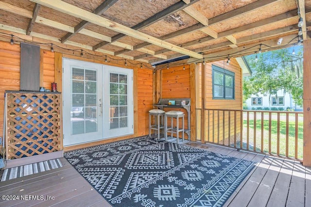 wooden deck featuring french doors