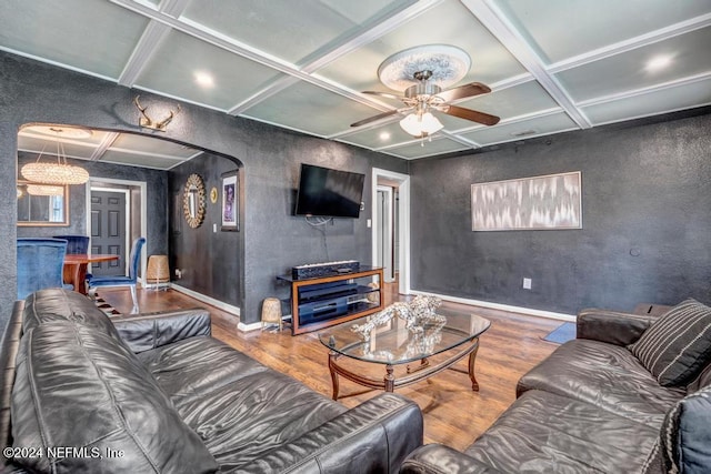 living room with hardwood / wood-style floors, ceiling fan, beamed ceiling, and coffered ceiling