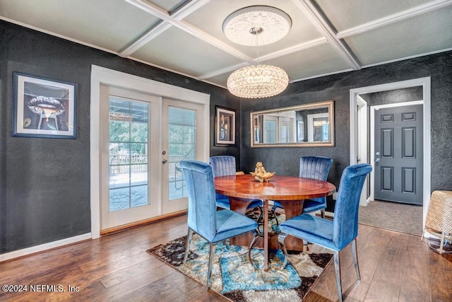 dining room with french doors, coffered ceiling, dark wood-type flooring, an inviting chandelier, and beamed ceiling