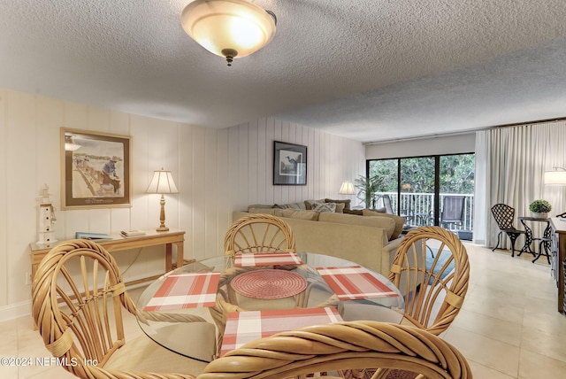 dining space with a textured ceiling