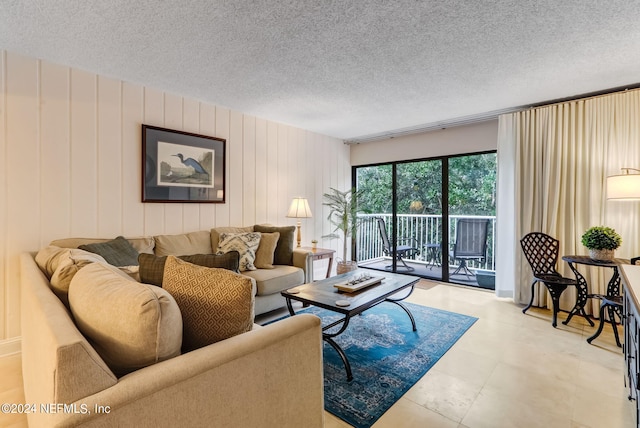 living area with a textured ceiling