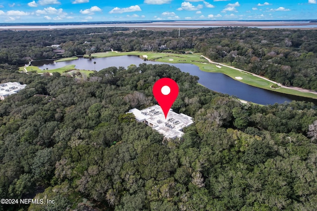 birds eye view of property with a water view, a forest view, and golf course view