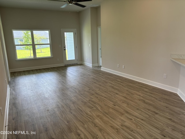 spare room featuring ceiling fan and dark hardwood / wood-style floors