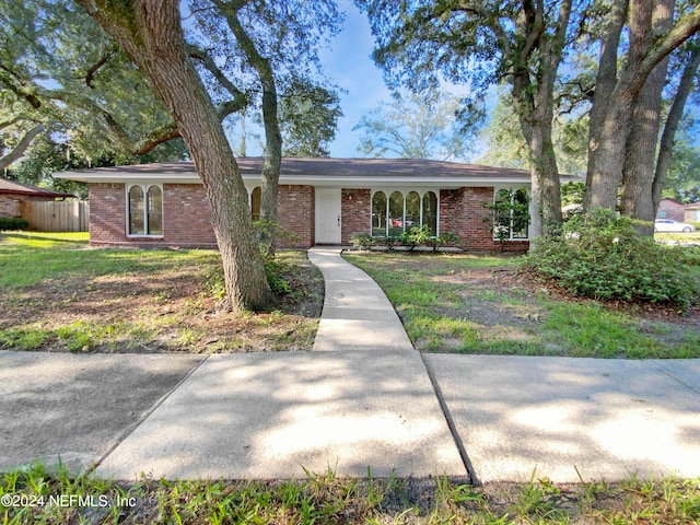 ranch-style house with a front yard