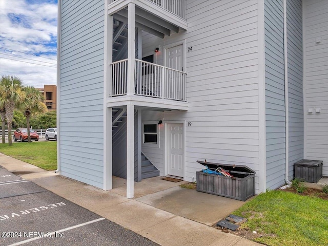 back of house featuring a balcony