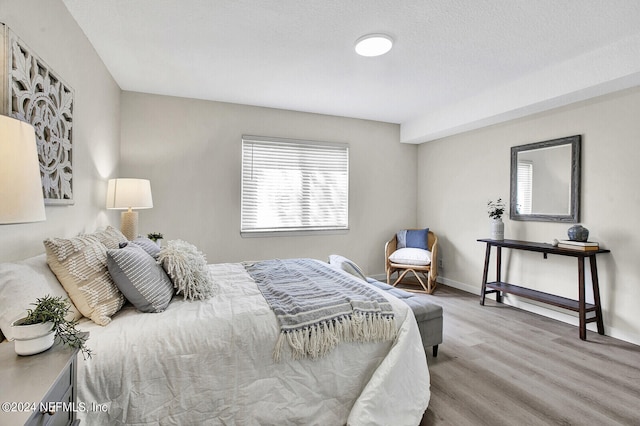 bedroom with light wood-type flooring