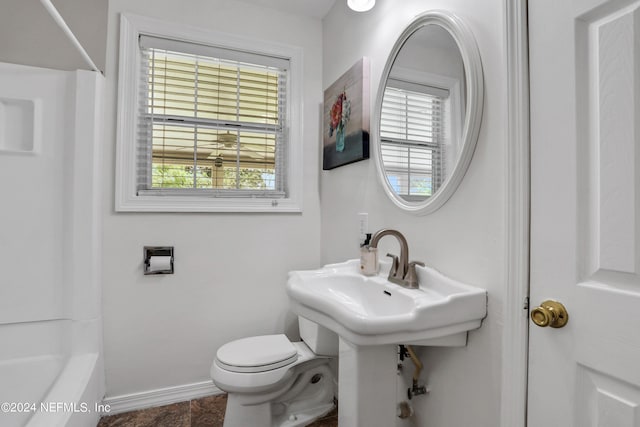 bathroom featuring toilet and tub / shower combination