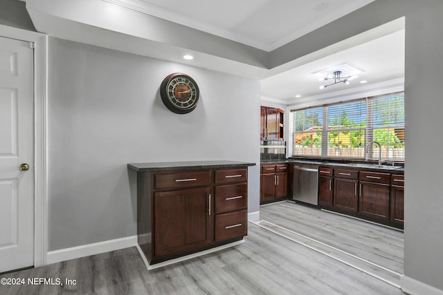 kitchen featuring sink, ornamental molding, stainless steel dishwasher, and light hardwood / wood-style floors