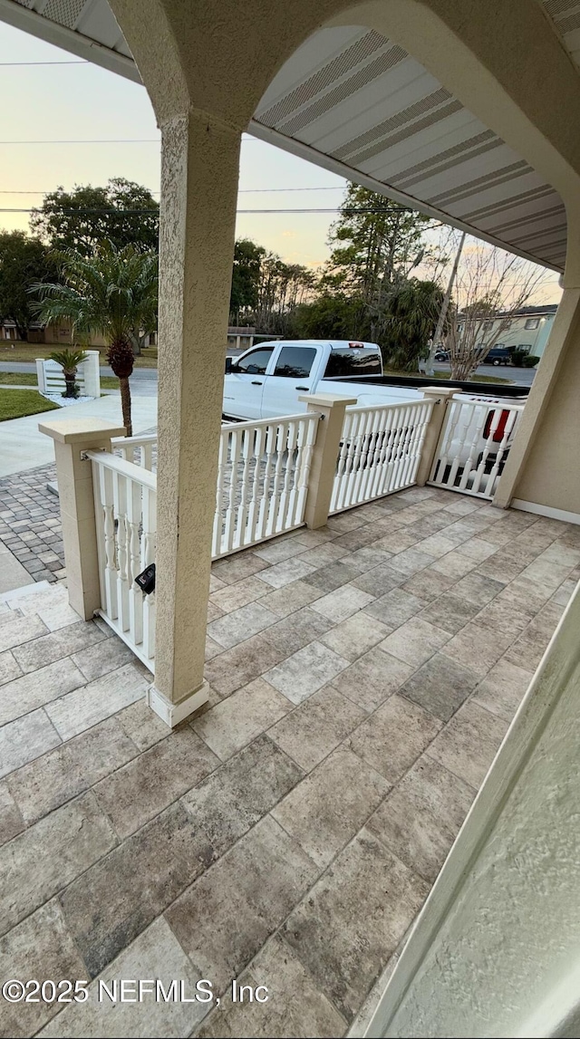 patio terrace at dusk with a porch