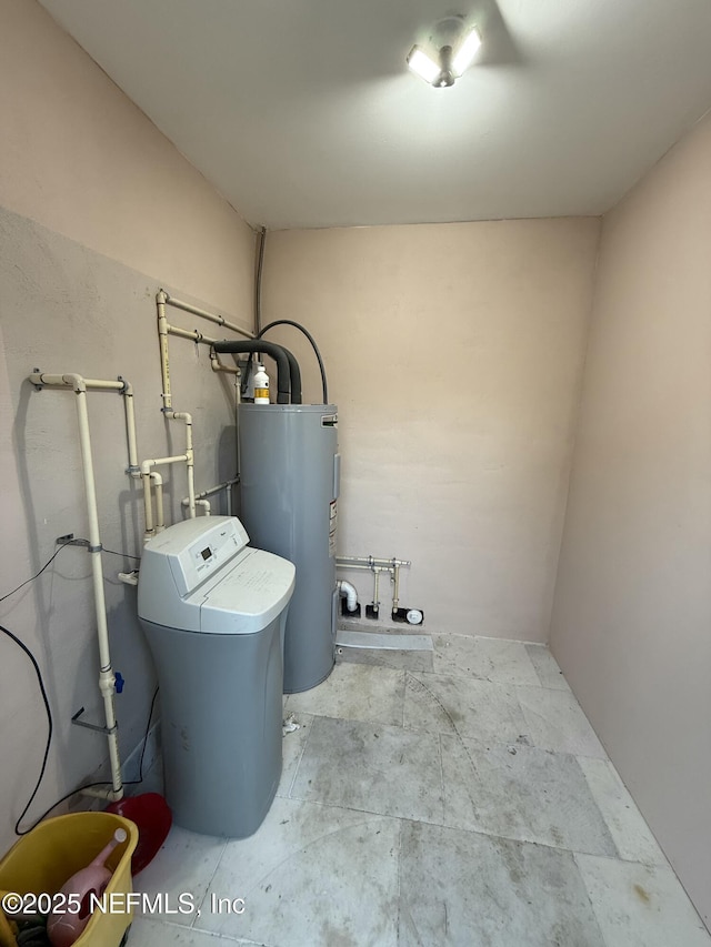 utility room with electric water heater