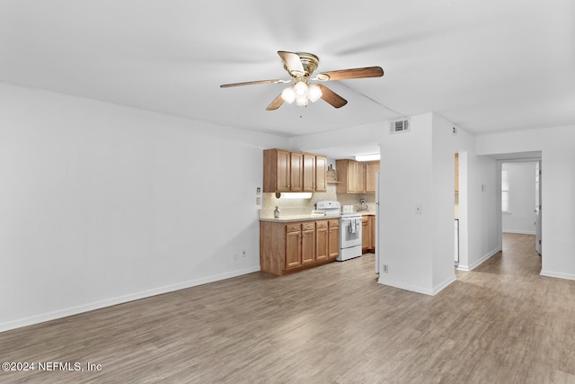 living room featuring ceiling fan and light hardwood / wood-style flooring