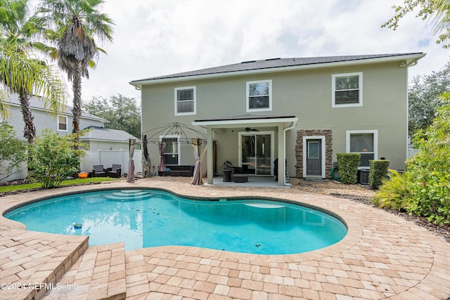 view of swimming pool with a patio area, fence, and a fenced in pool