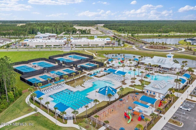 birds eye view of property with a water view