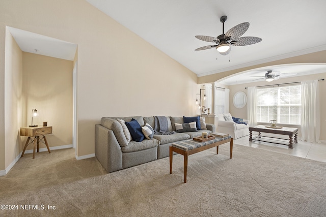 living room featuring ceiling fan, light colored carpet, crown molding, and vaulted ceiling