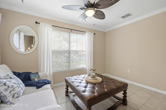 living room featuring light tile patterned floors, ceiling fan, and crown molding