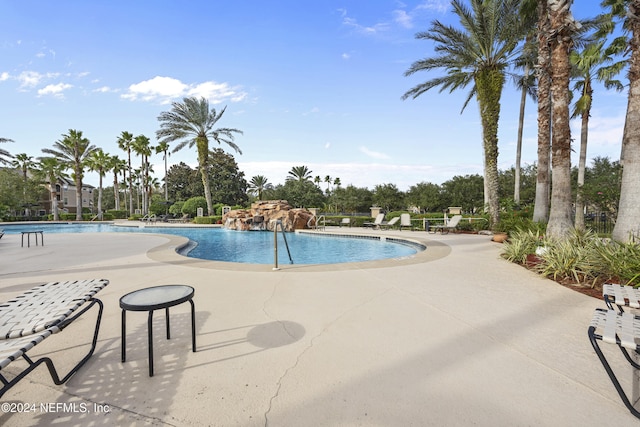 view of swimming pool with a patio area