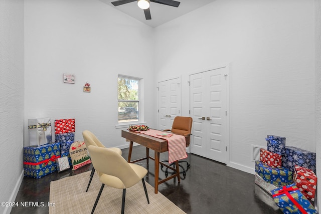 home office with high vaulted ceiling and ceiling fan