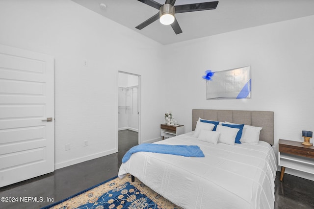 bedroom with a closet, a spacious closet, and ceiling fan