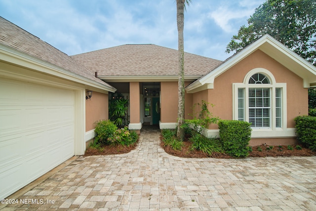 ranch-style home with a garage