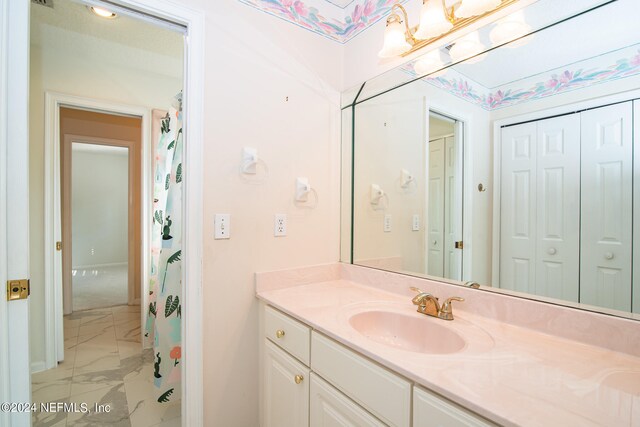 bathroom featuring tile patterned floors and vanity