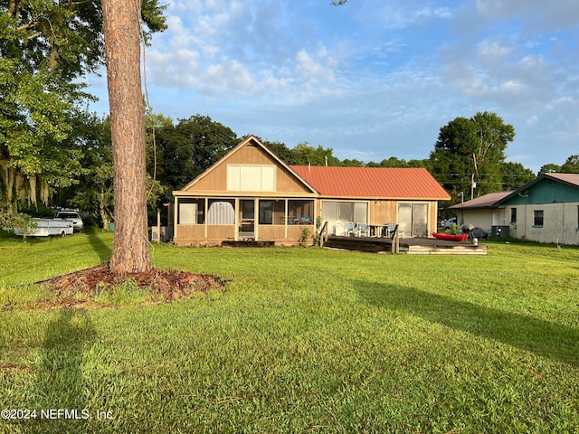 back of house with a yard