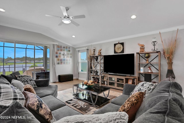 living room featuring vaulted ceiling, ceiling fan, crown molding, and light hardwood / wood-style floors