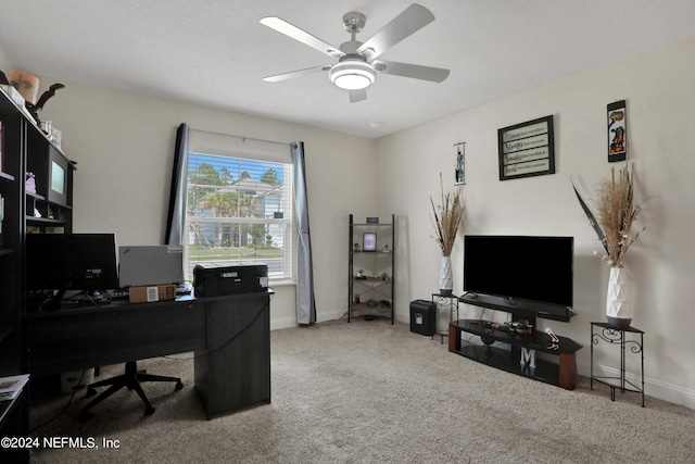 home office with carpet floors and ceiling fan