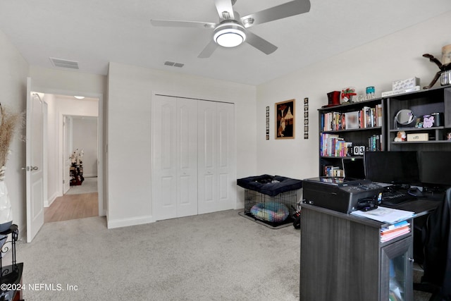 office area with ceiling fan and carpet flooring