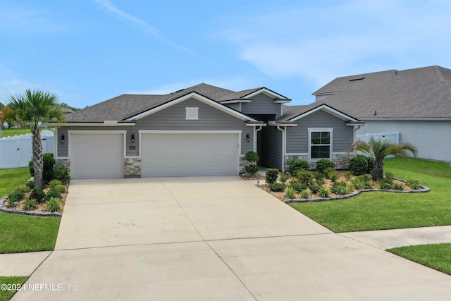 view of front of home with a garage and a front yard