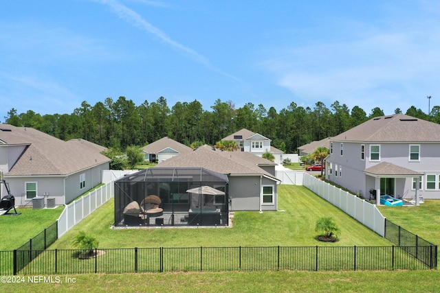 exterior space featuring a yard and a lanai