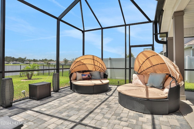 view of patio / terrace featuring a lanai