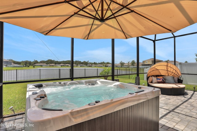 view of swimming pool featuring a hot tub and a patio area