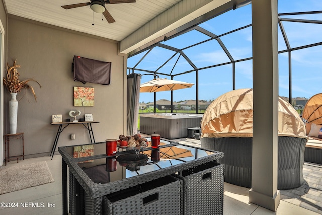 view of patio / terrace featuring a hot tub, a lanai, and ceiling fan