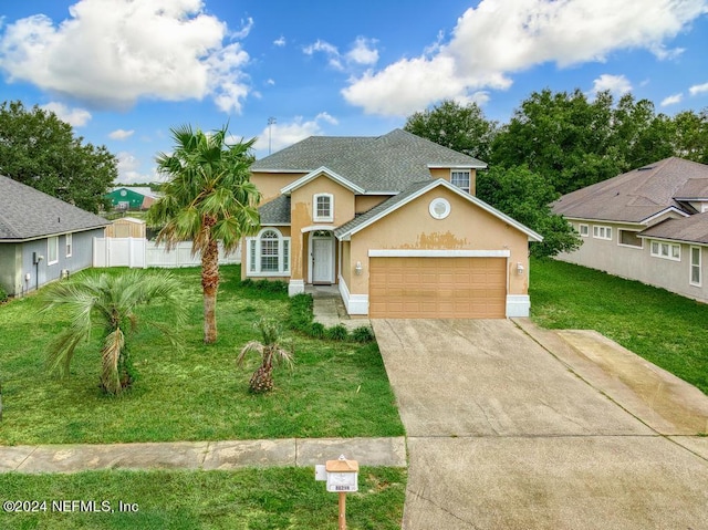 view of front of house with a garage and a front yard