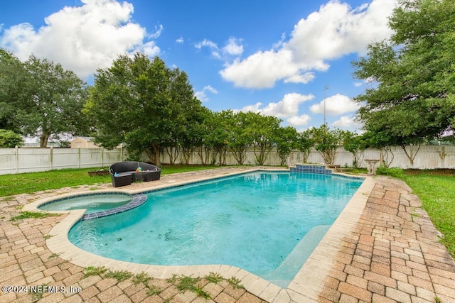 view of swimming pool featuring an in ground hot tub