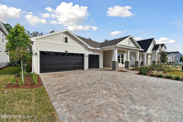 view of front facade with a garage and covered porch