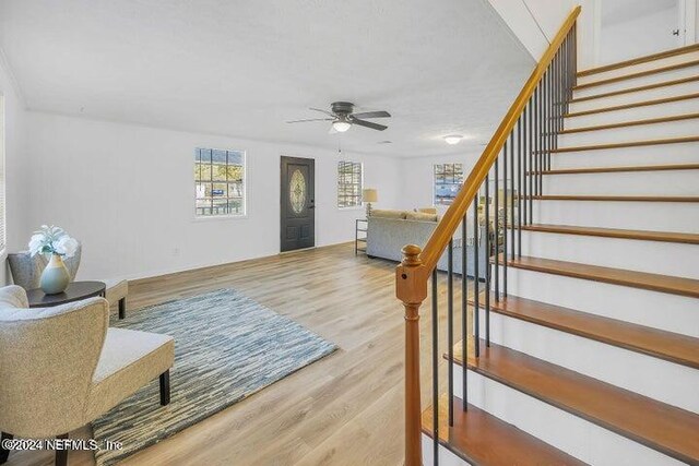 entrance foyer featuring light hardwood / wood-style flooring and ceiling fan