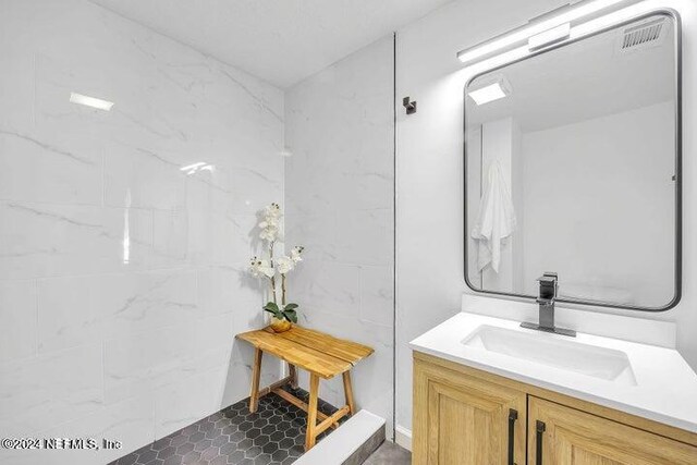 bathroom featuring tile patterned floors and vanity