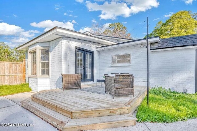 rear view of house with a wooden deck