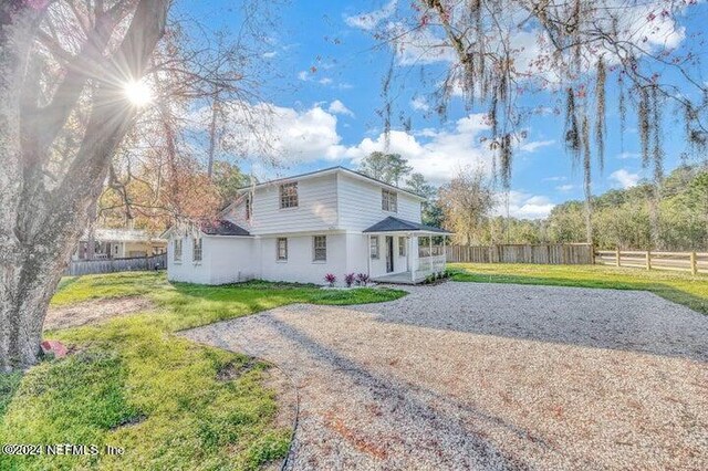 view of front of house with a front lawn